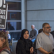 Arriving international travelers pass protesters on the first day of the the partial reinstatement of the Trump travel ban, temporarily barring travelers from six Muslim-majority nations from entering the U.S., at Los Angeles International Airport (LAX) on June 29, 2017 in Los Angeles, California.